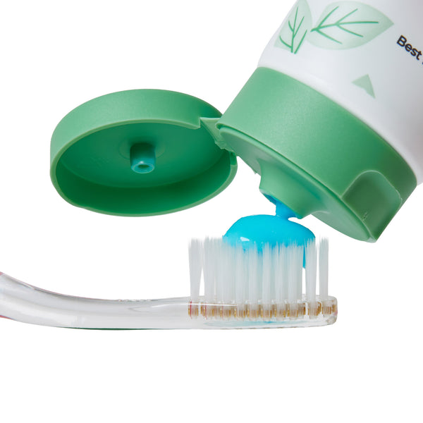 DentraWhite Smile Glow Up toothpaste tube with toothbrush and mint gel detail